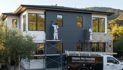 Professional house painters working on residential exterior in Berkeley, CA
