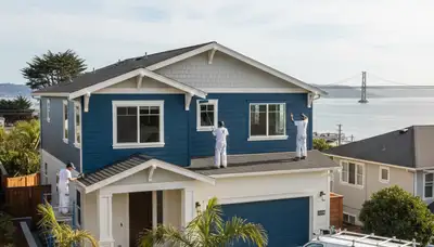 Professional house painters in Berkeley CA painting a residential exterior home façade