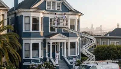 Professional house painters in Berkeley, CA applying exterior paint to a residential home façade